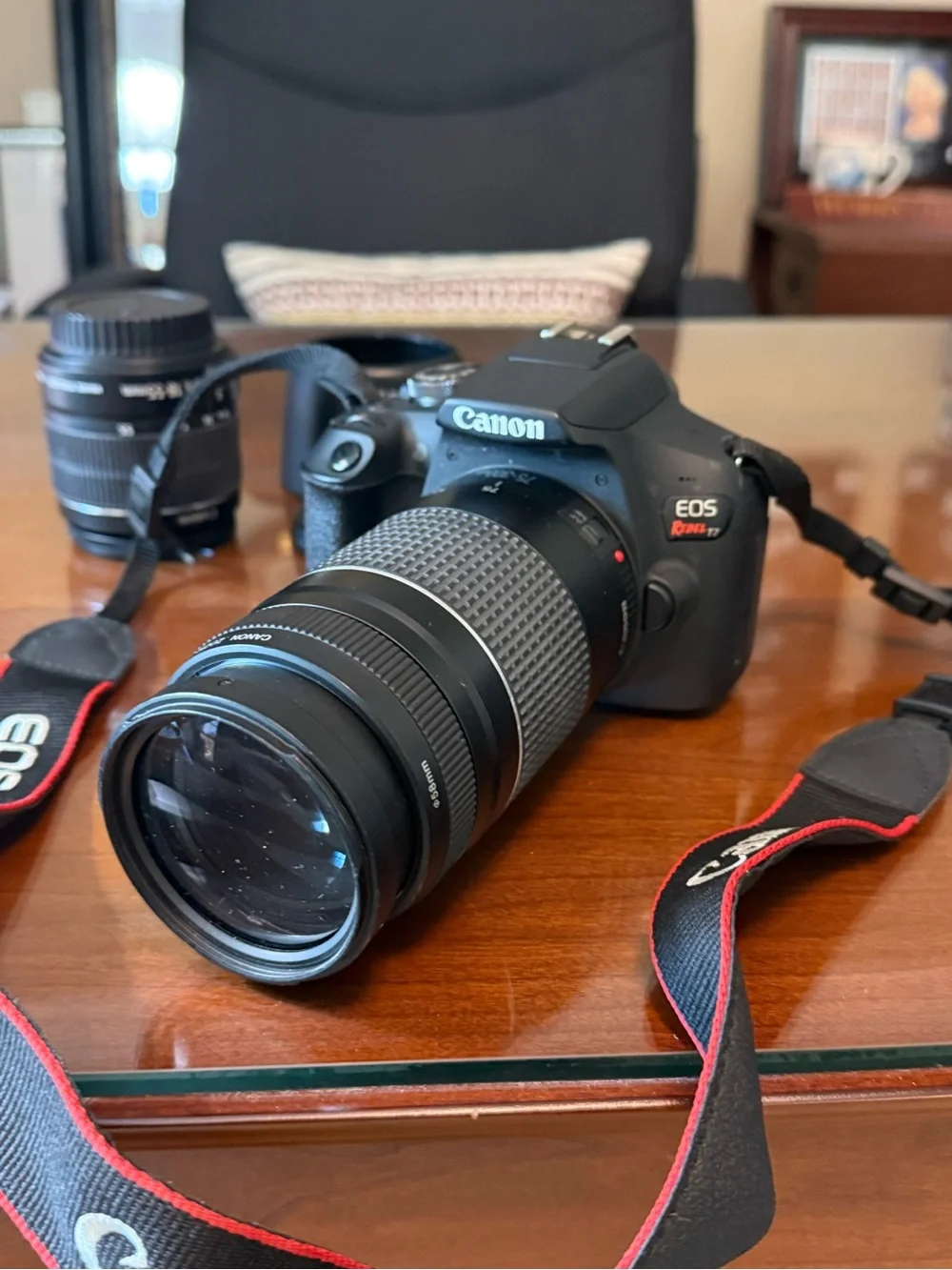 Canon EOS Rebel T5i Black DSLR with Long Black Telephoto Lens